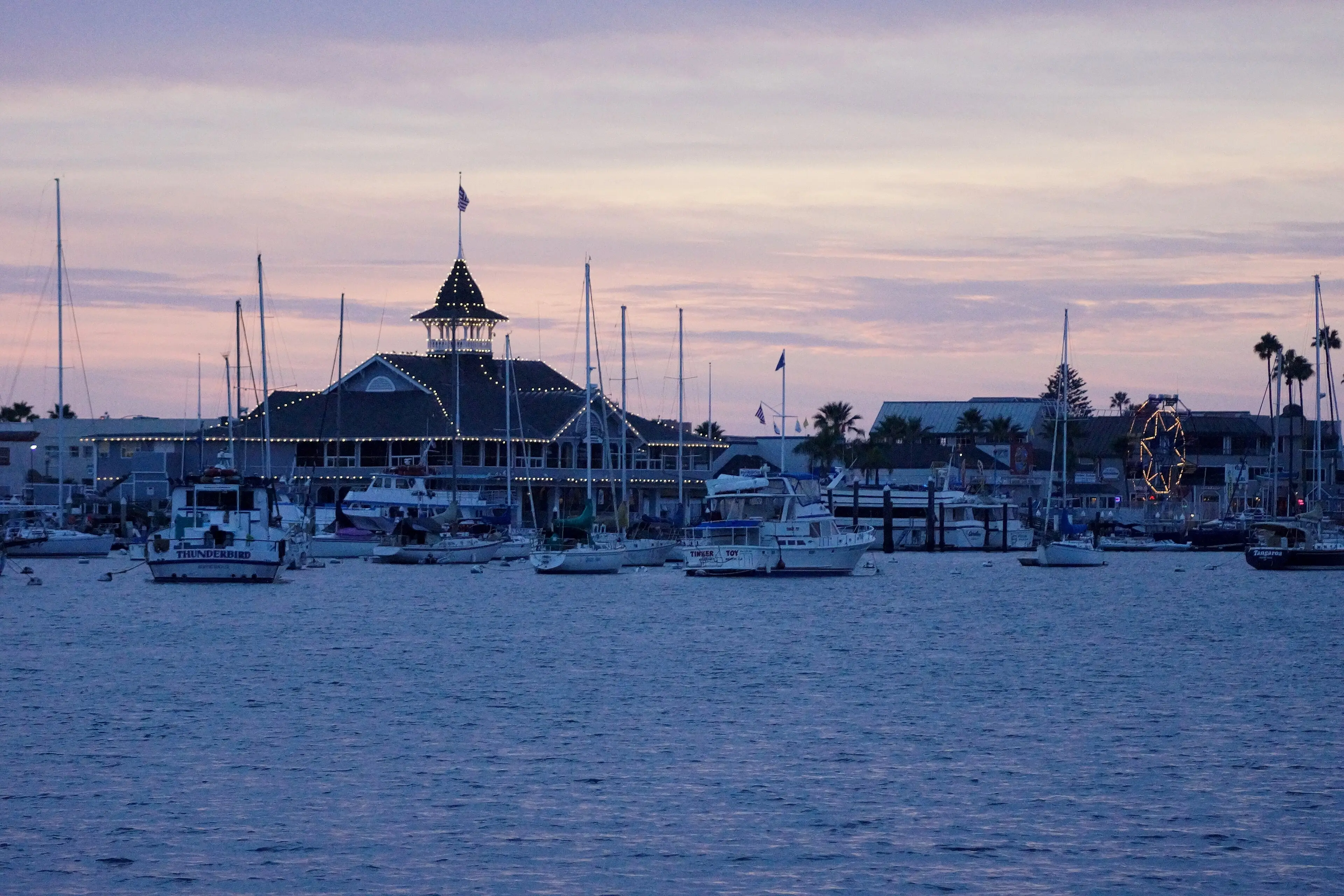 Balboa Pavilion at dusk, seen from the harbor.
